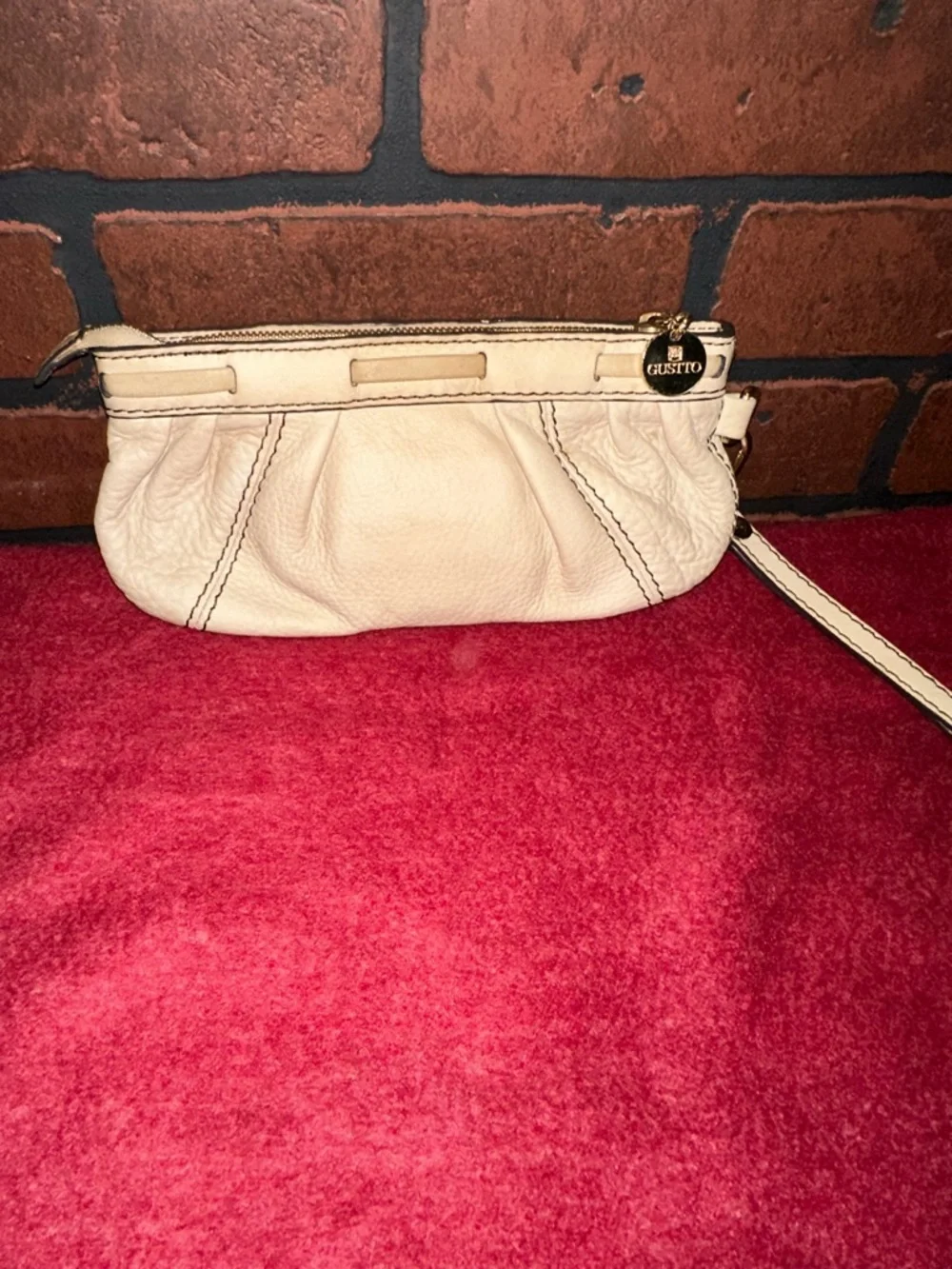 Cream Leather Wristlet Clutch with Gold Medallion Accent